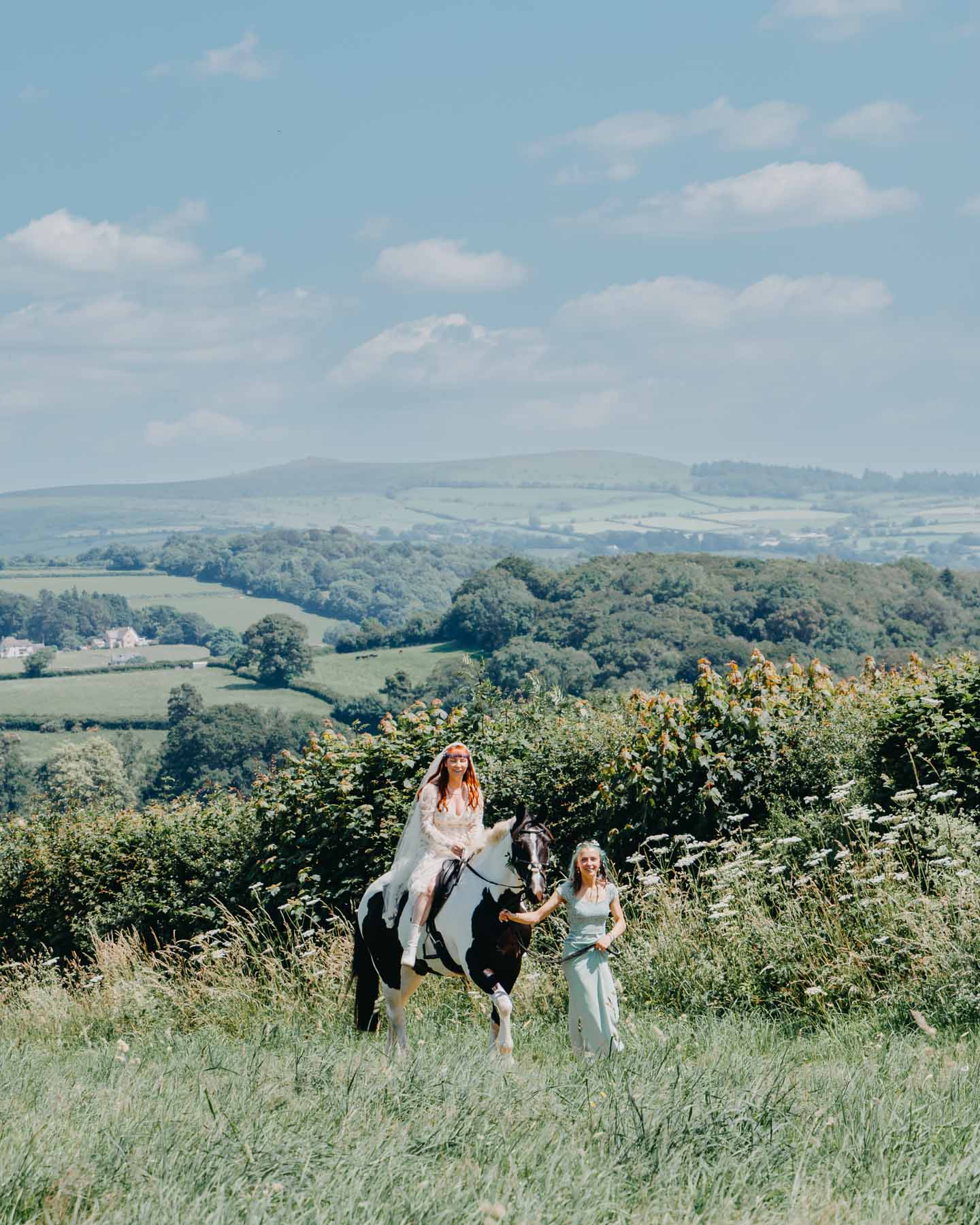 the bride is riding a horse to the handfasting ceremony