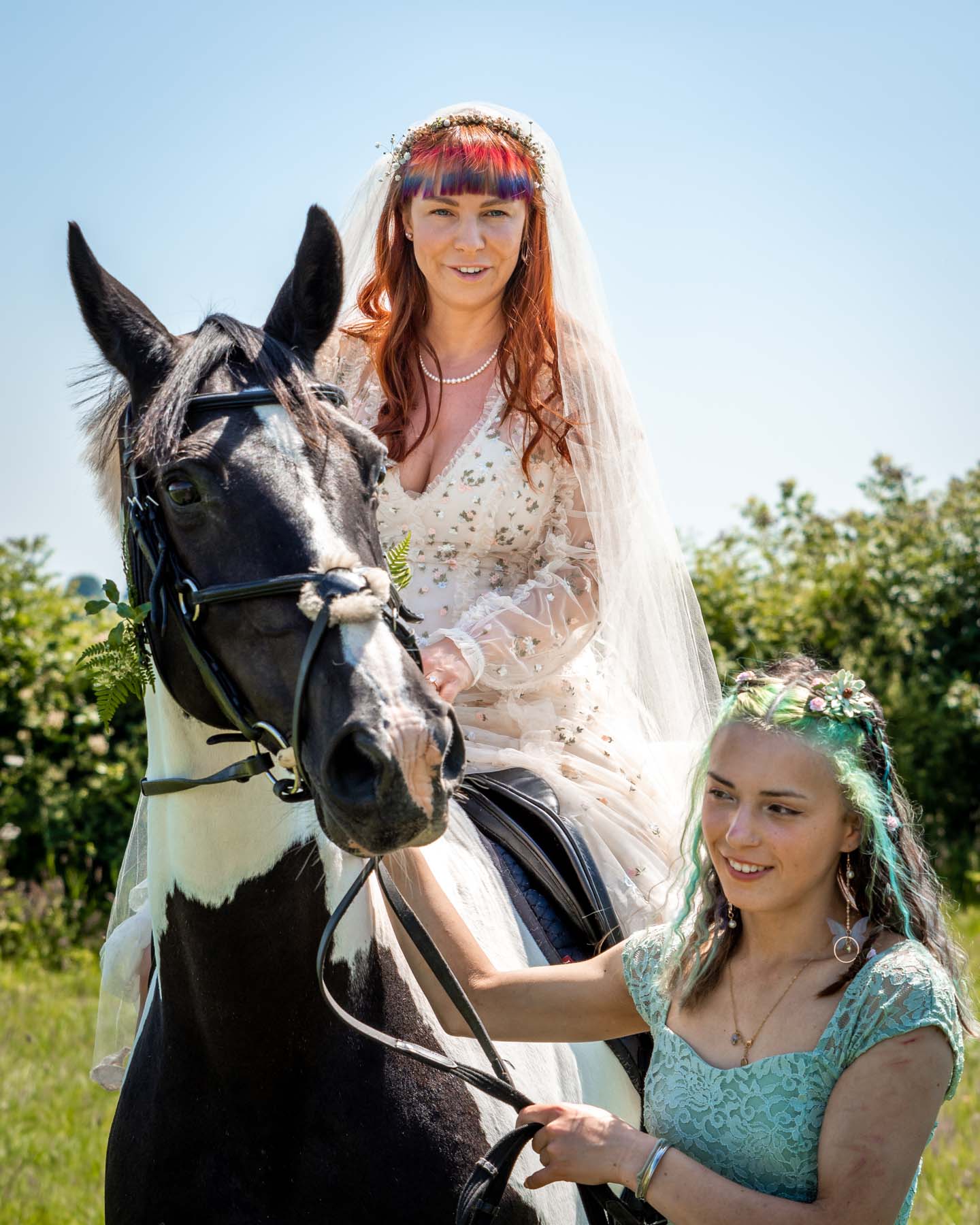 the bride and her horse and her bridesmaid before the handfasting ceremony