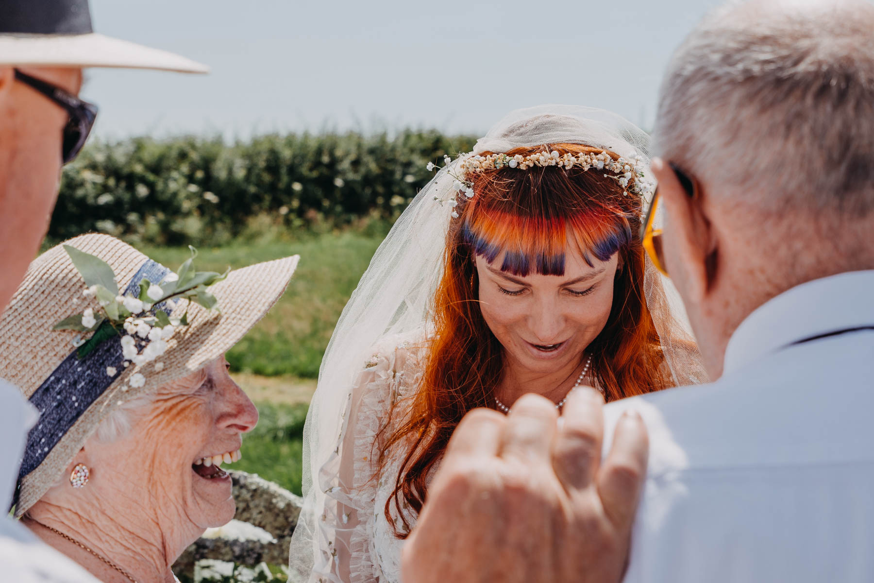 The bride, her grandfather and her smiling grandmother