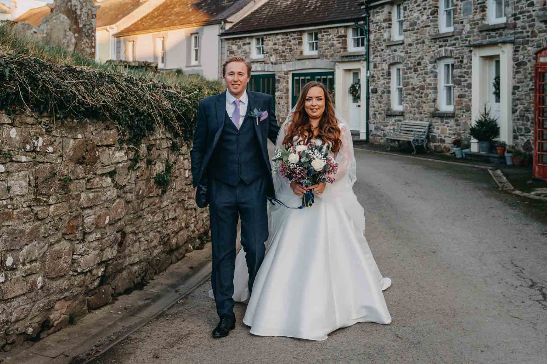 Bride and Groom on the street in Myddfai - natural wedding photography Wales