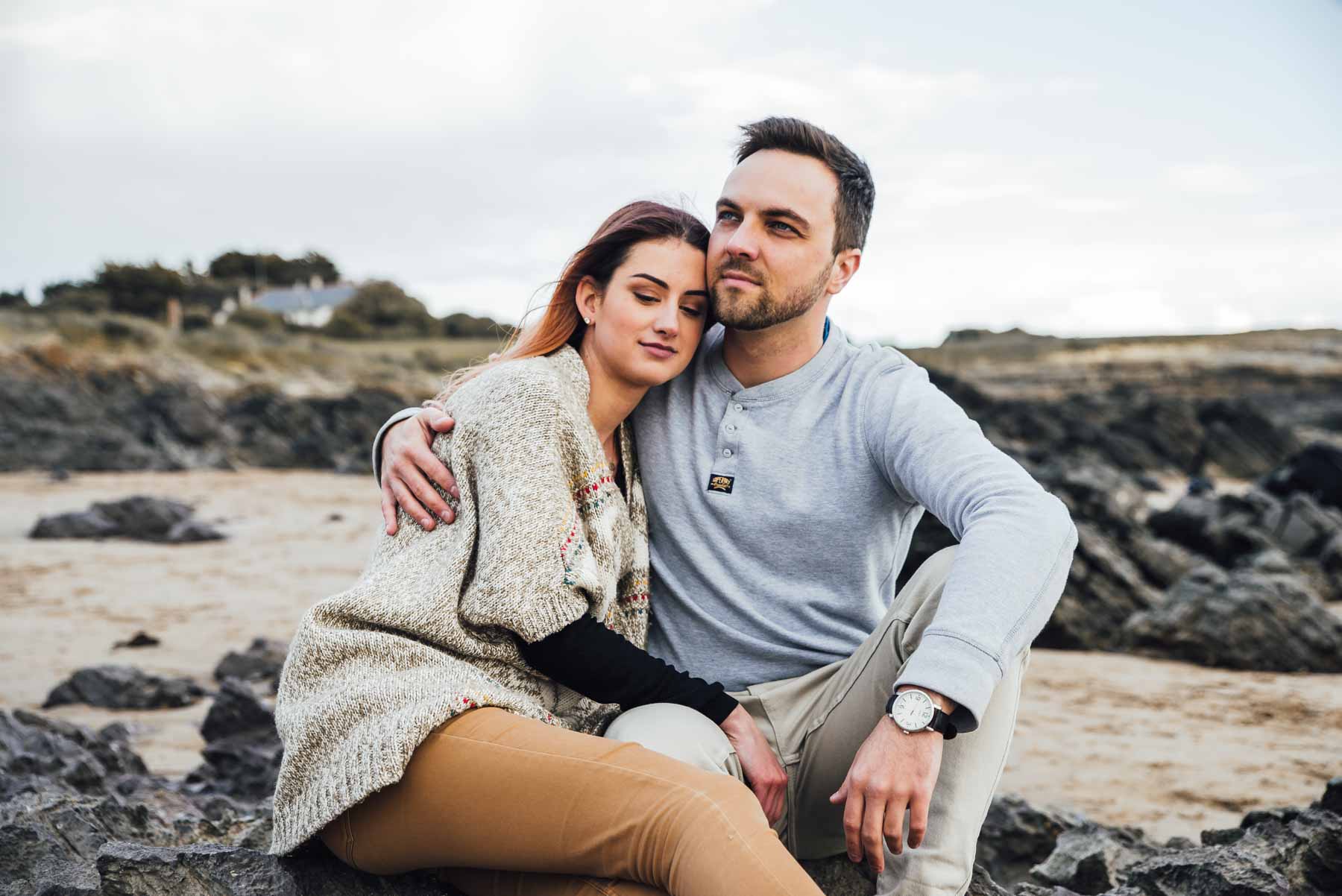 Couple Photoshoot - Couple sitting by the sea