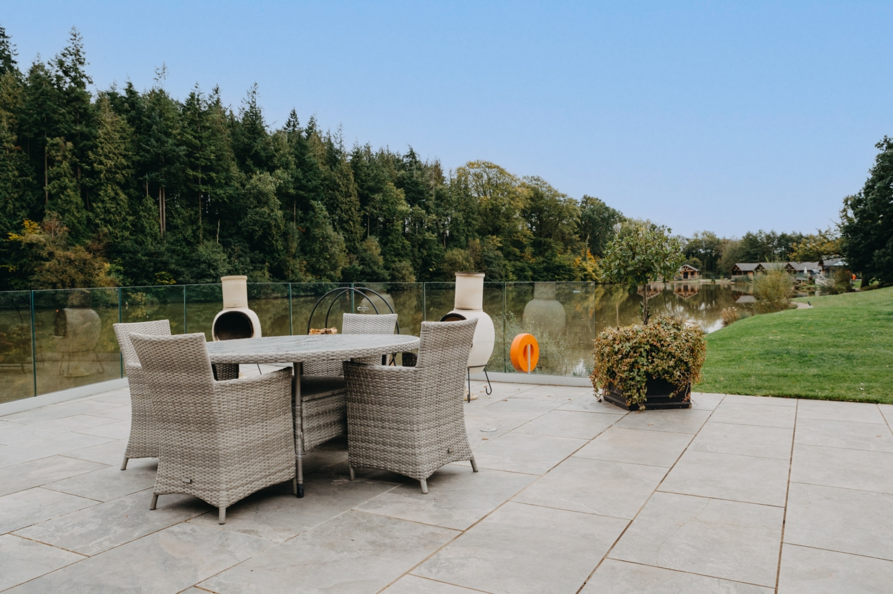 Outdoor patio at Canada Lodge & Lake, ideal for intimate wedding receptions with stunning lake views, perfect for couples seeking romantic wedding venues in a natural setting.