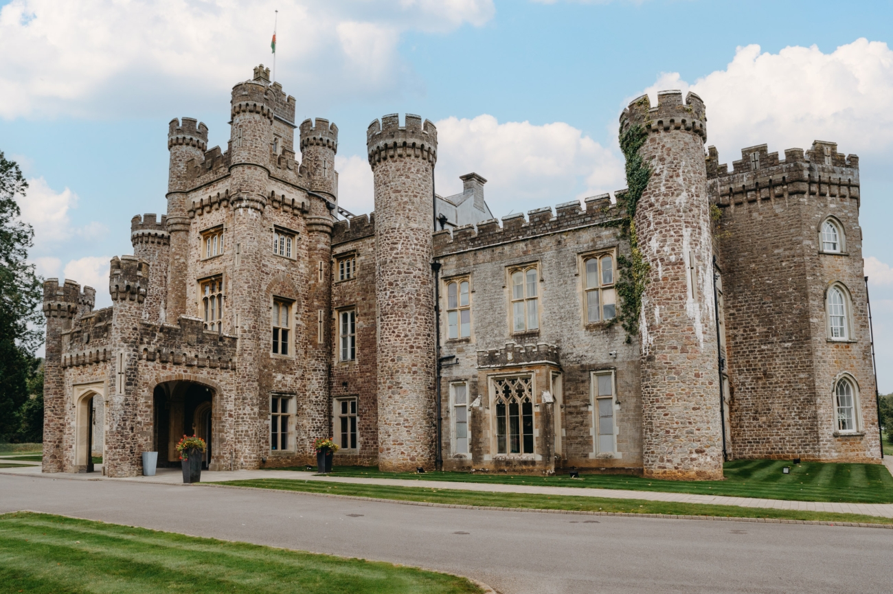 A side view of the historic Hensol Castle in South Wales, showcasing its timeless architecture and elegant setting for weddings.