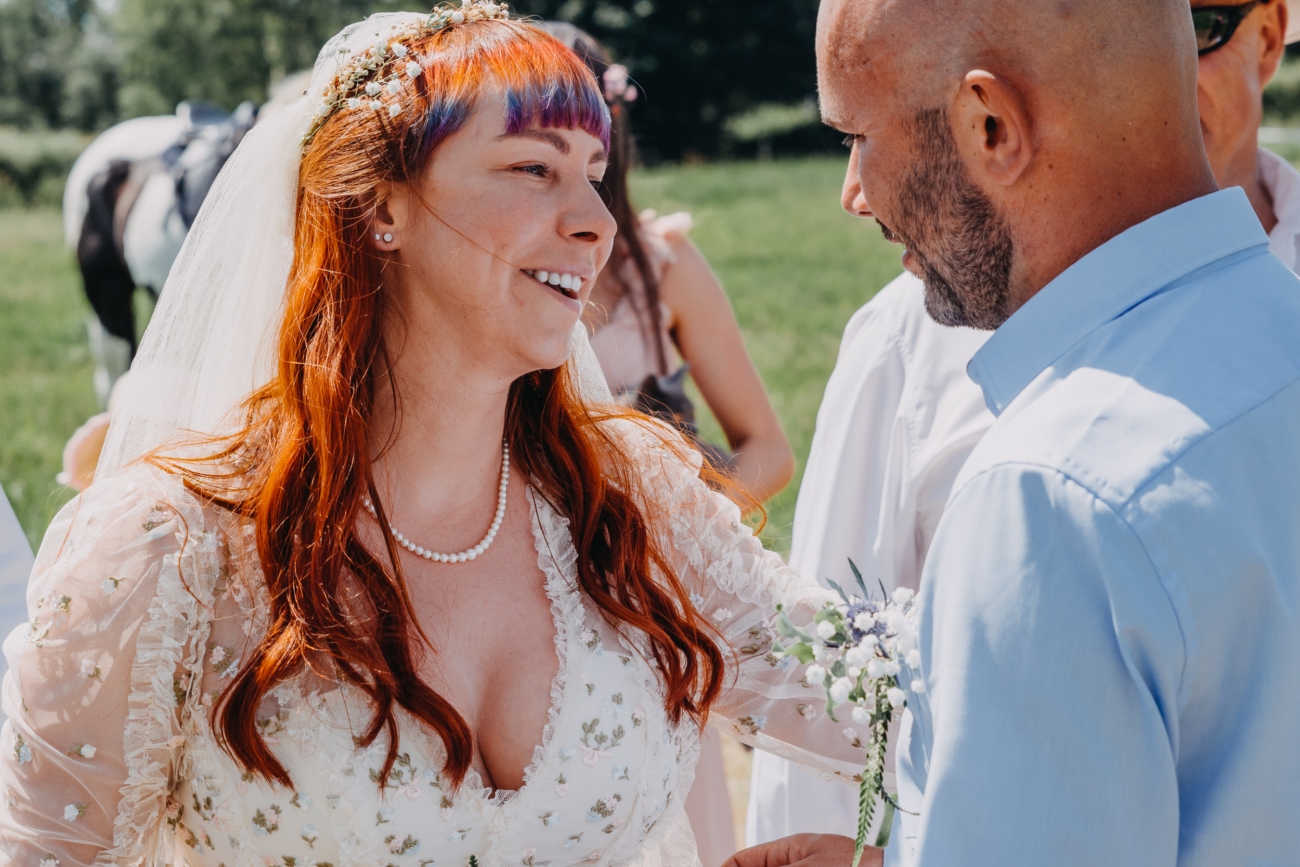 Bride sharing a heartfelt moment with the groom, showcasing authentic wedding photography.