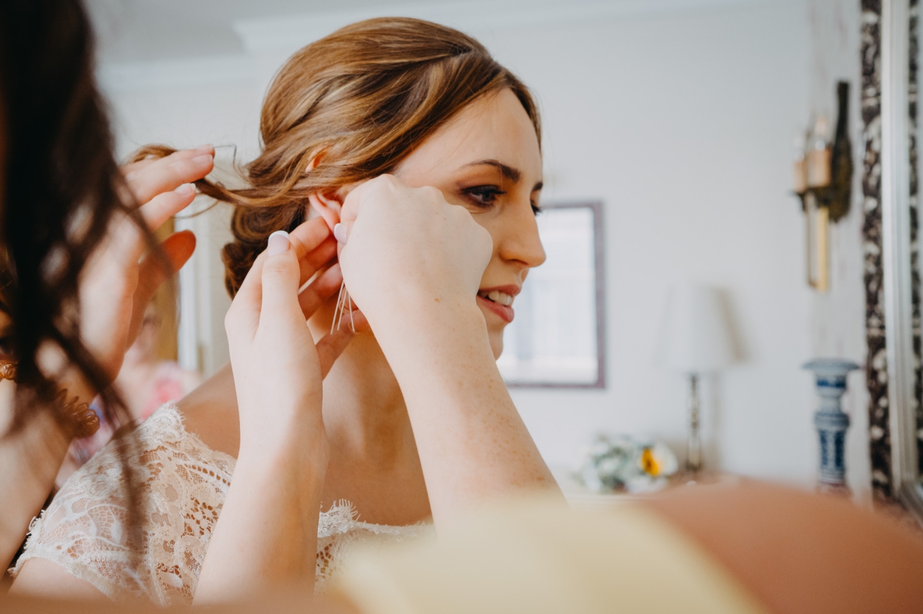 Bride getting final touches before her wedding at The Imperial Hotel Torquay.
