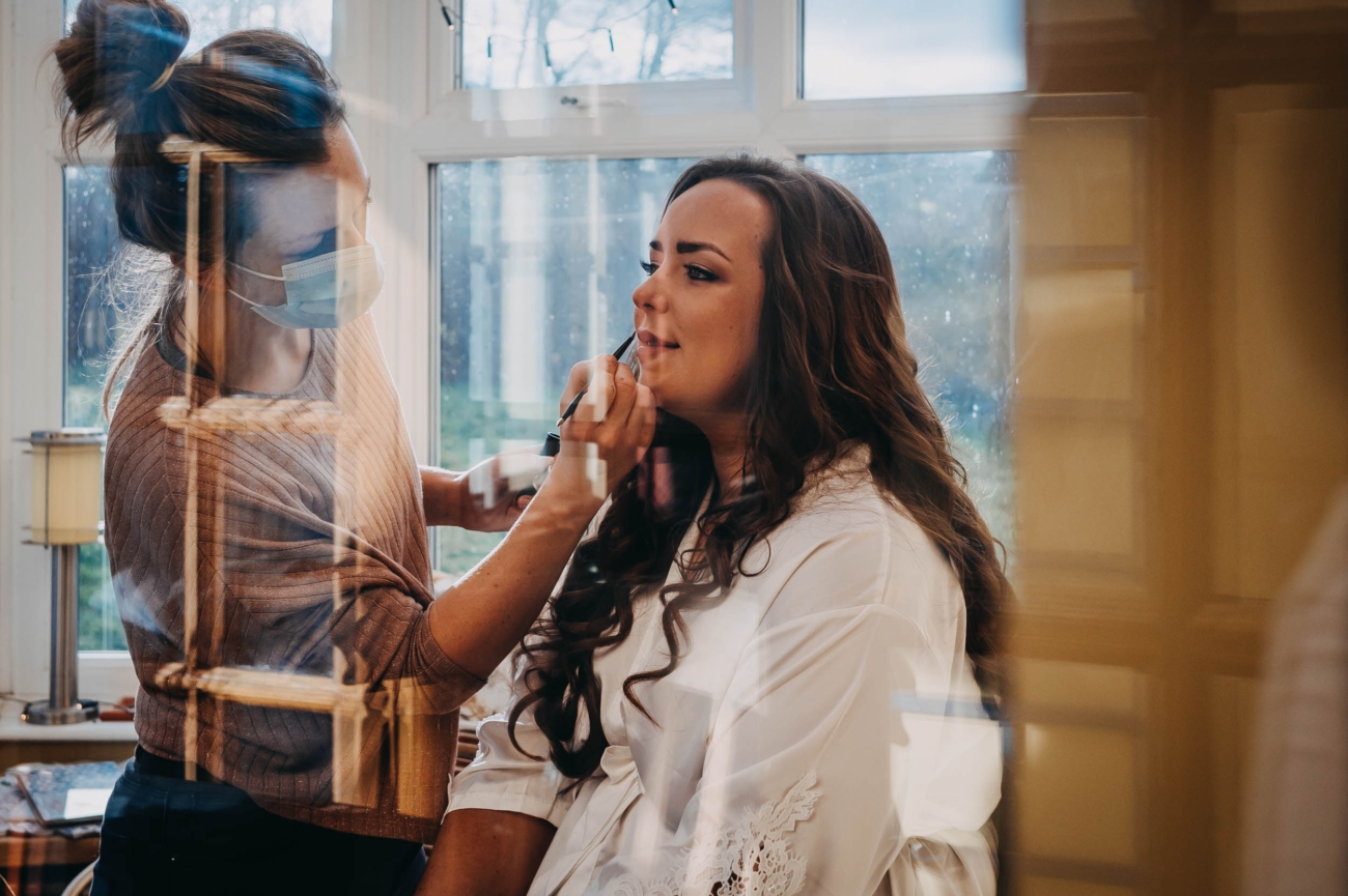 Bride getting ready at home before Myddfai wedding – candid moment captured by documentary wedding photographer