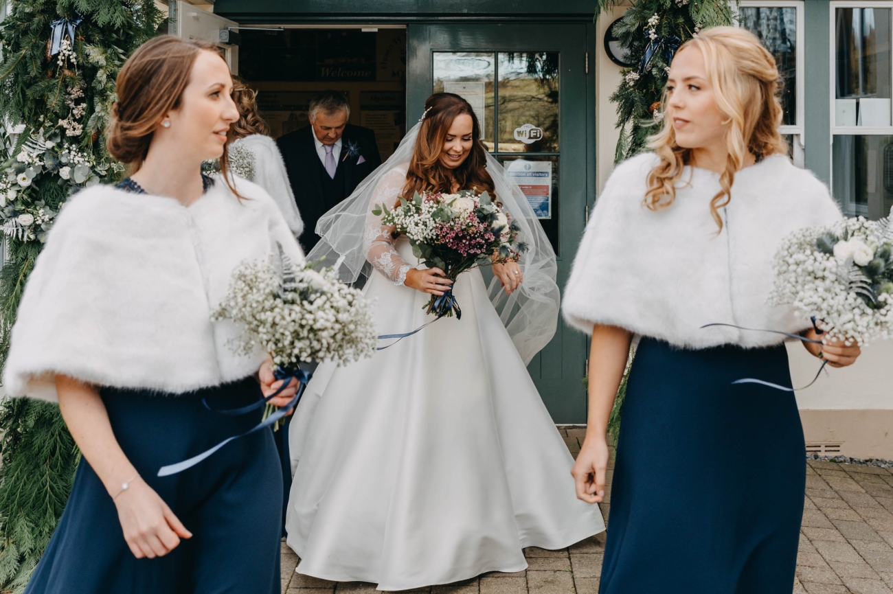 Bride leaving Myddfai Community Hall with her bridesmaids before the ceremony
