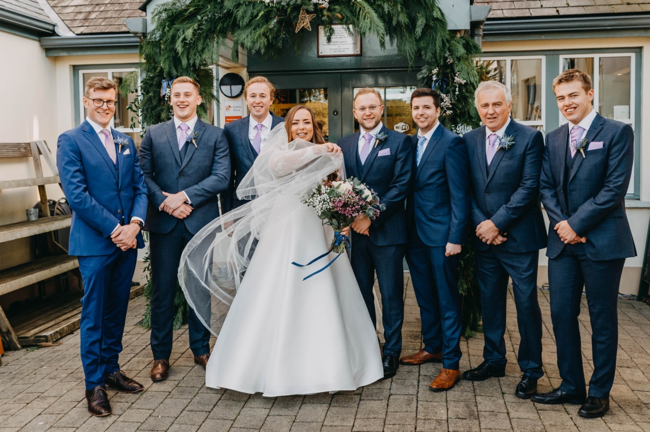 Group portrait with the bride and her groomsmen at Myddfai Community Hall