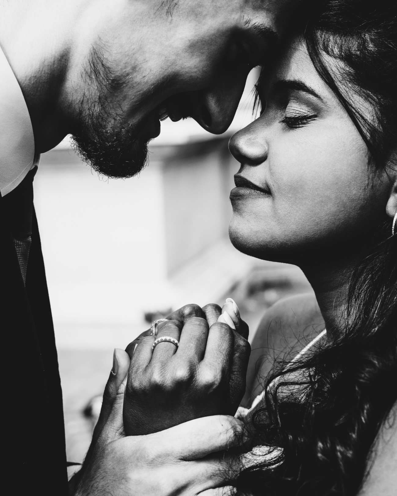 candid wedding portrait capturing emotional connection, perfect wedding portrait idea close-up candid wedding portrait of a couple holding hands, one of the best wedding portrait ideas