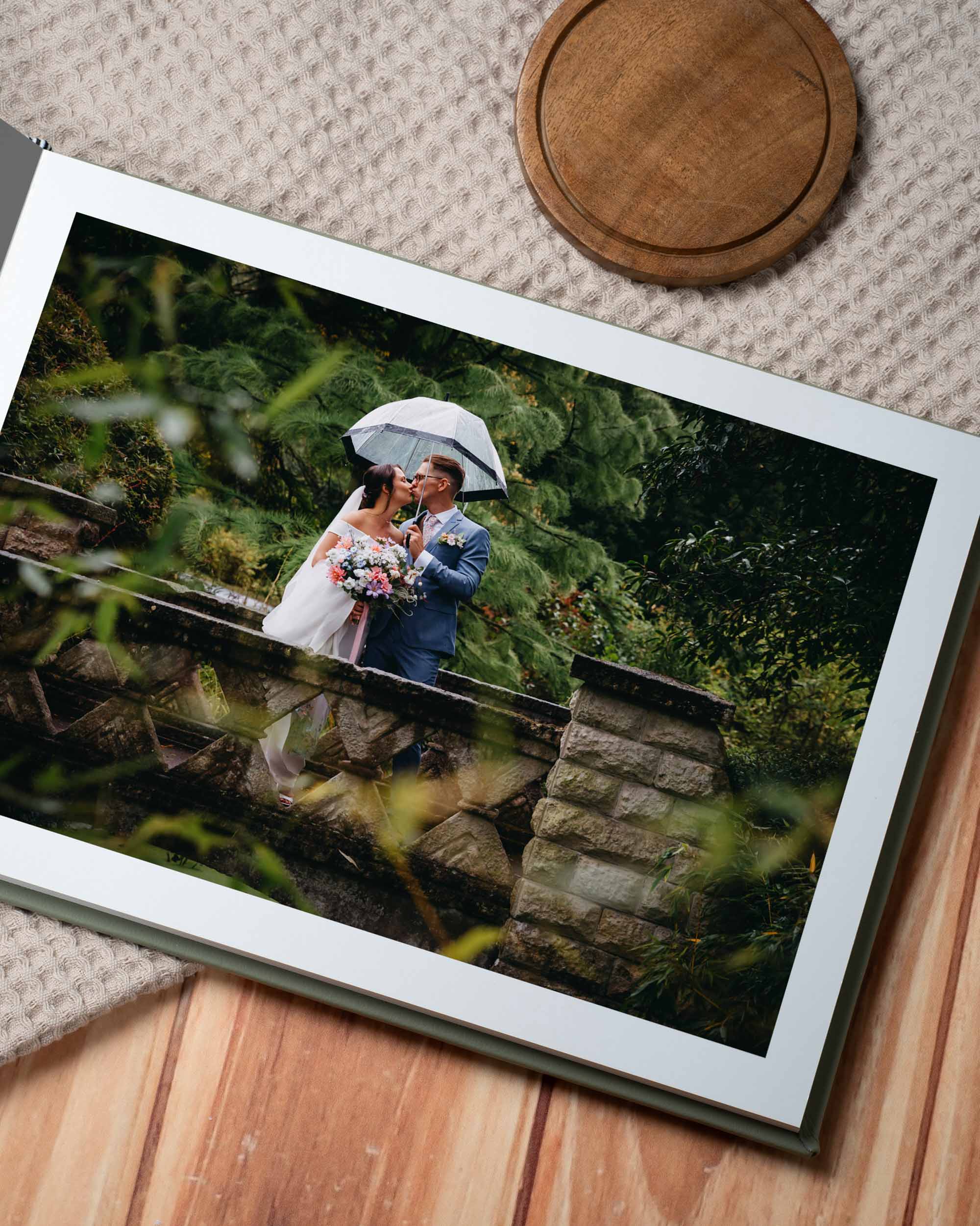 Printed wedding album showing a full-spread photograph from a wedding day