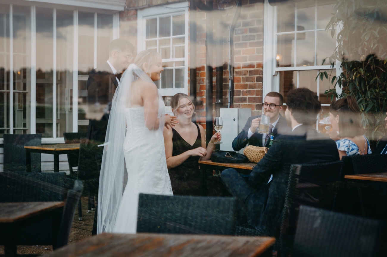 Wedding guests gathered around the bride after the ceremony