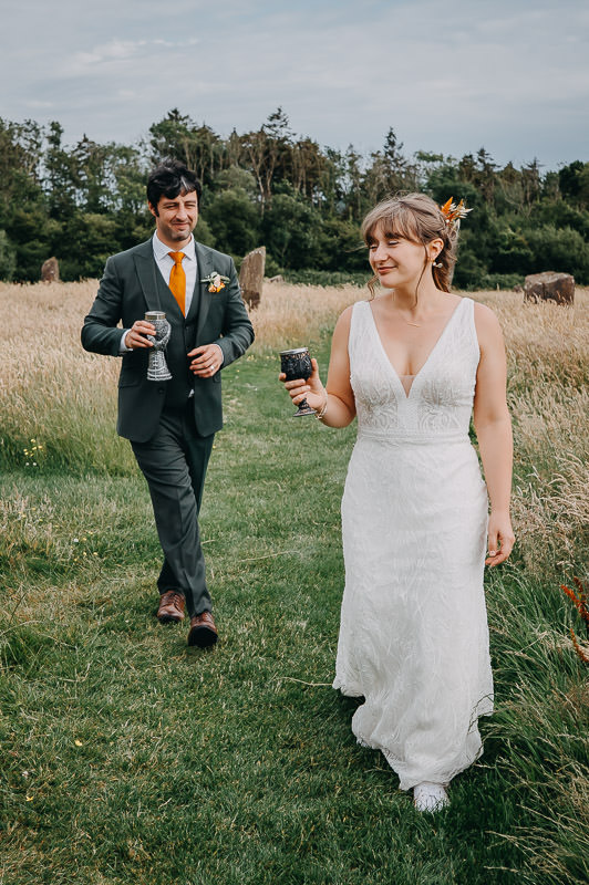 Couple walking at Coed Weddings wedding venue near Cardiff