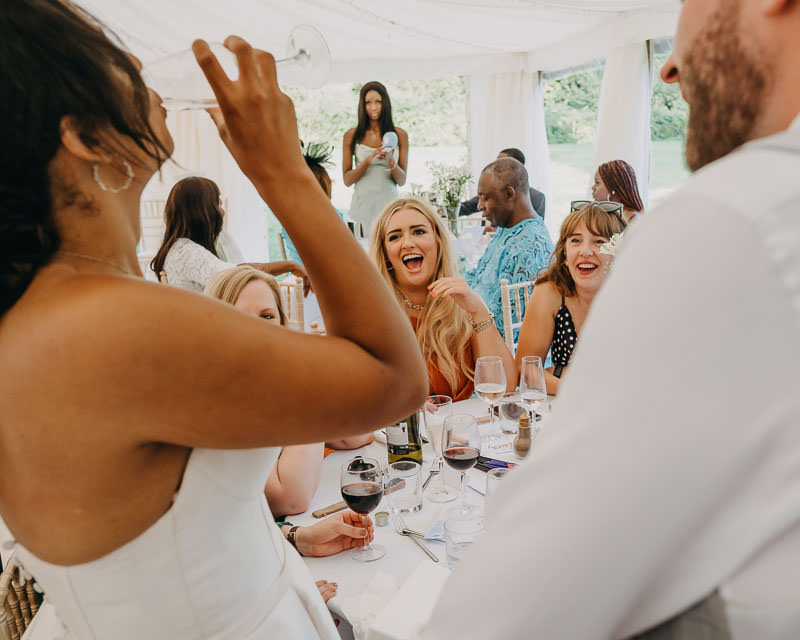 wedding reception in South Wales guests laughing and celebrating