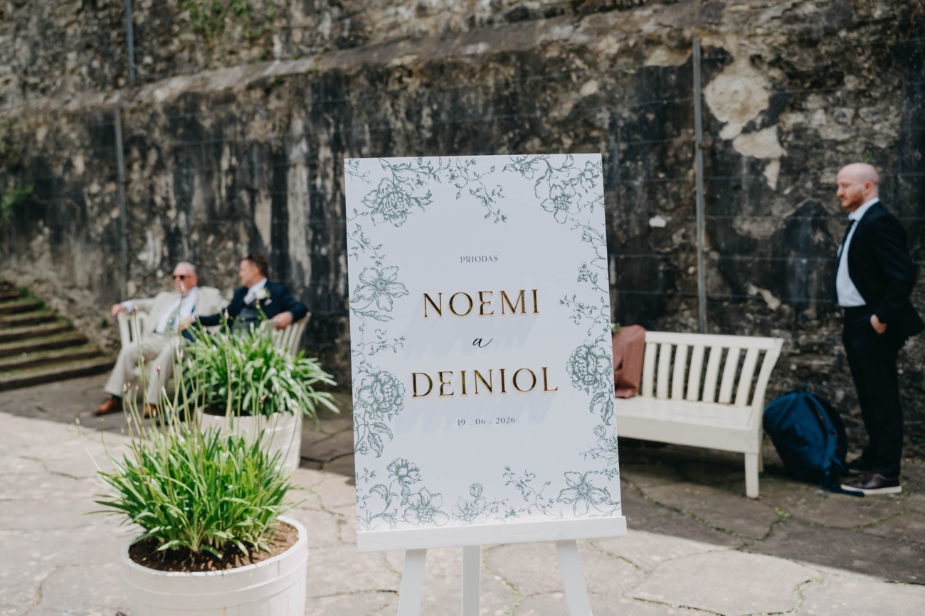 Wedding welcome sign beside the pond in the Italian Gardens at St Fagans
