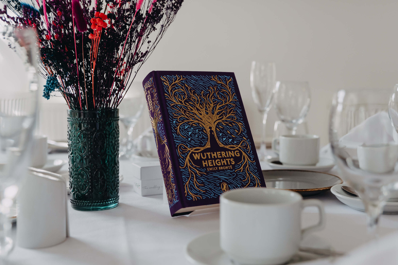 Wuthering Heights by Emily Brontë used as a wedding table centrepiece with dried flower arrangements