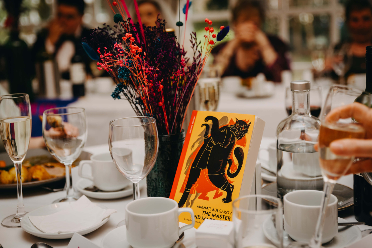 The Master and Margarita by Mikhail Bulgakov featured in a book-themed wedding table arrangement with dried flowers